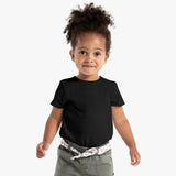 Child wearing a black t-shirt and gray pants with a floral bandana on a white background