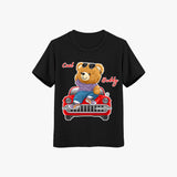 Black short-sleeve crew neck kids t-shirt with a graphic of a teddy bear wearing sunglasses and sitting in a red car.