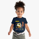 Child wearing a navy blue t-shirt with a colorful pirate ship design and text on a white background
