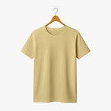 Beige t-shirt on a wooden hanger against a white background