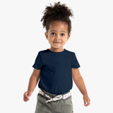 Child wearing a navy blue t-shirt on a white background