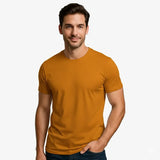 Man wearing a mustard yellow t-shirt on a white background