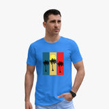 A man wearing a blue organic cotton t-shirt with a graphic of palm trees in a striped pattern.