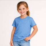 Young girl wearing a blue t-shirt and jeans on a white background