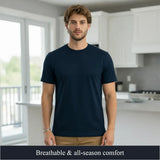 Man wearing a navy blue t-shirt in a modern kitchen